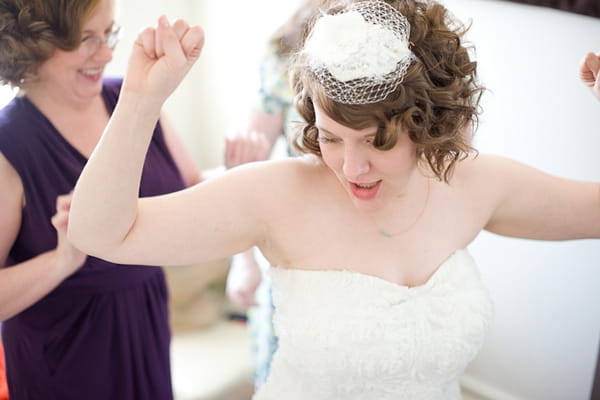 Bride with arms in the air - A Fun, Fun, Fun Wedding