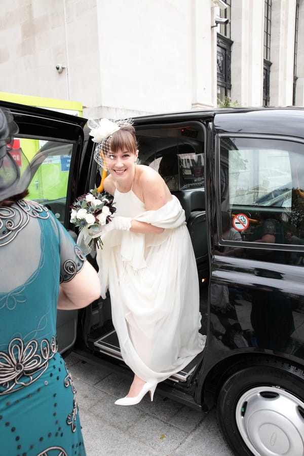 Bride getting out of London black cab - Picture by Rebecca Prigmore Photography