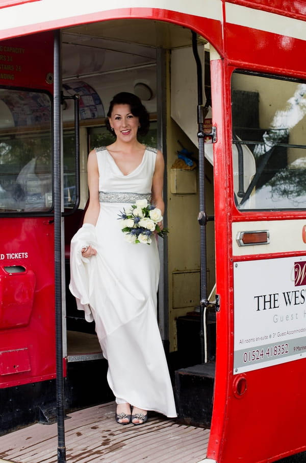 Bride on back of red bus - Picture by Jonathan Bean Photography