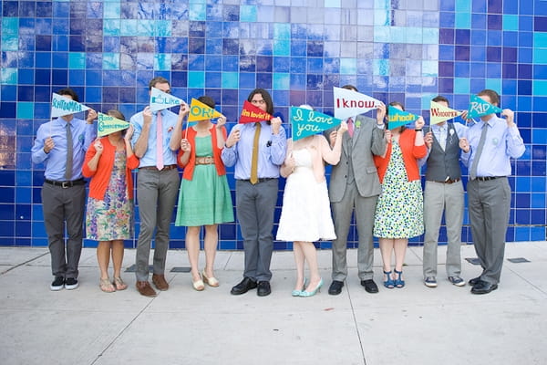 Bridal party holding flags - A Fun, Fun, Fun Wedding