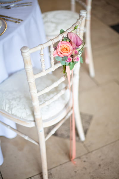 Flowers hanging on back of chair - LoveLuxe Launch