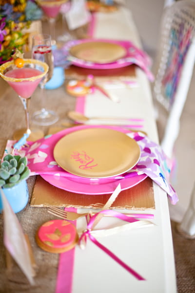 Gold plates on pink mats - LoveLuxe Launch