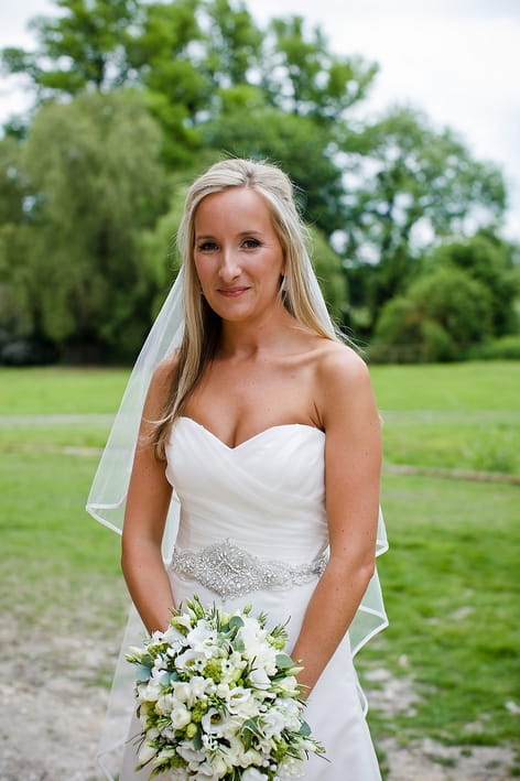 Bride holding bouquet - A Beautiful Garden Party Wedding at Lains Barn