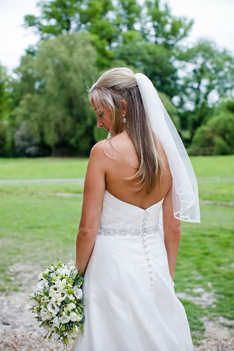 Back of bride's dress - A Beautiful Garden Party Wedding at Lains Barn