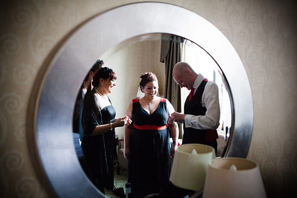 Reflection of groom and bridesmaids in mirror - An Art Deco Themed Civil Partnership