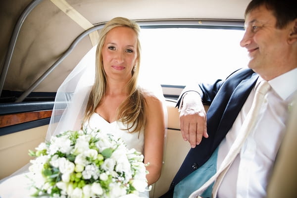 Bride sitting in wedding car with father - A Beautiful Garden Party Wedding at Lains Barn