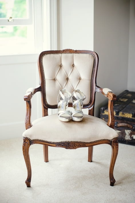 Jimmy Choo bridal shoes on chair - A Beautiful Garden Party Wedding at Lains Barn