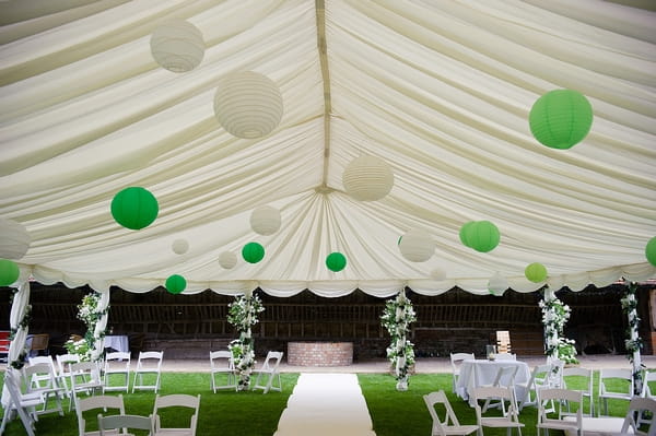 White and green lanterns hanging from wedding marquee - A Beautiful Garden Party Wedding at Lains Barn