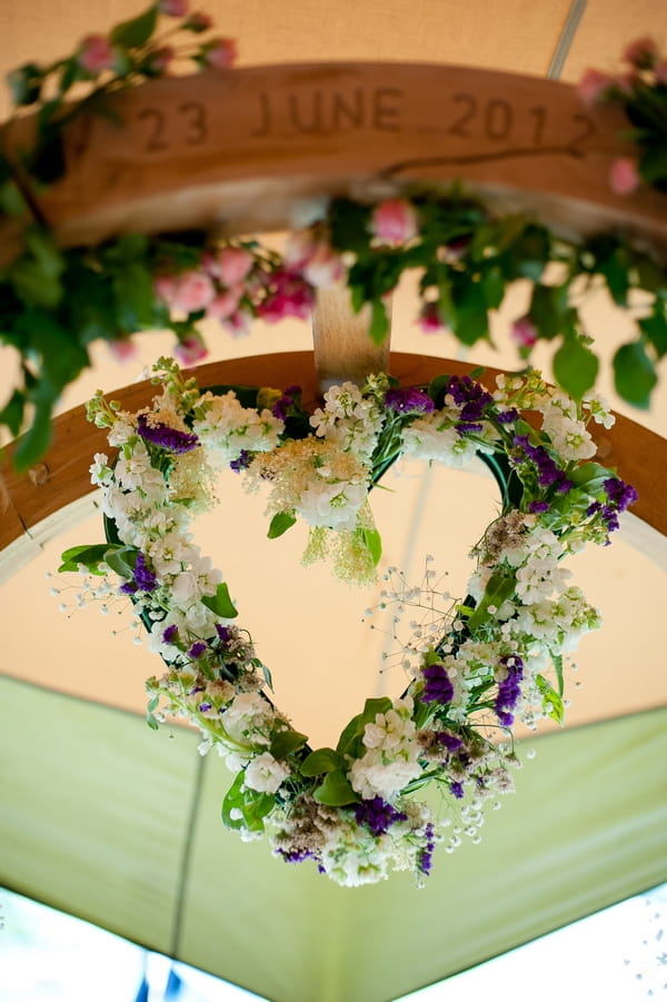 Floral heart wreath on arch - A Wedstock Wedding in Hertfordshire