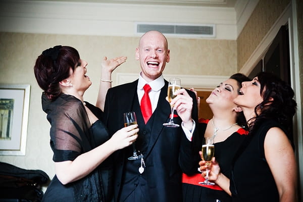 Groom drinking Champagne with bridesmaids - An Art Deco Themed Civil Partnership