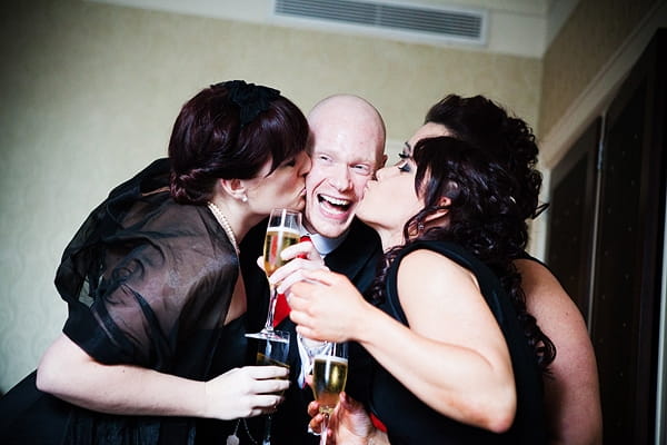 Bridesmaids kissing groom - An Art Deco Themed Civil Partnership