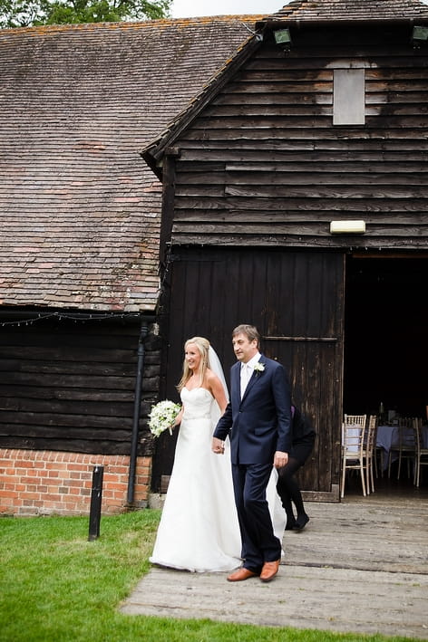 Bride and father walking to wedding ceremony - A Beautiful Garden Party Wedding at Lains Barn