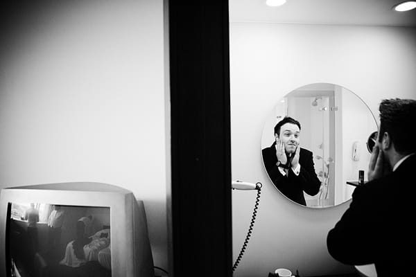 Groom applying aftershave - An Art Deco Themed Civil Partnership