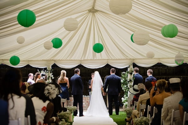 Wedding ceremony in marquee - A Beautiful Garden Party Wedding at Lains Barn