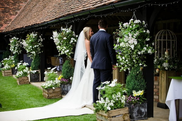 Bride and groom in wedding ceremony - A Beautiful Garden Party Wedding at Lains Barn