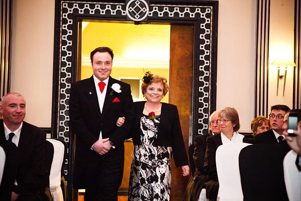 Groom entering civil partnership ceremony with mother - An Art Deco Themed Civil Partnership