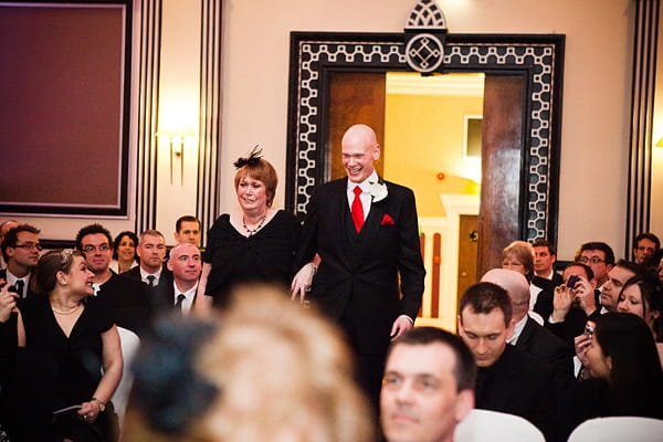 Groom walking into civil partnership ceremony with mother - An Art Deco Themed Civil Partnership