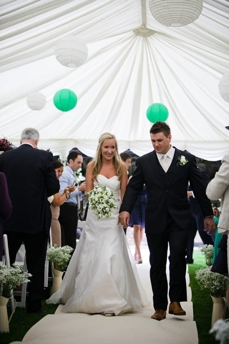 Bride and groom leave ceremony - A Beautiful Garden Party Wedding at Lains Barn