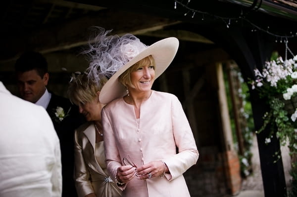 Bride's mother in pink outfit - A Beautiful Garden Party Wedding at Lains Barn