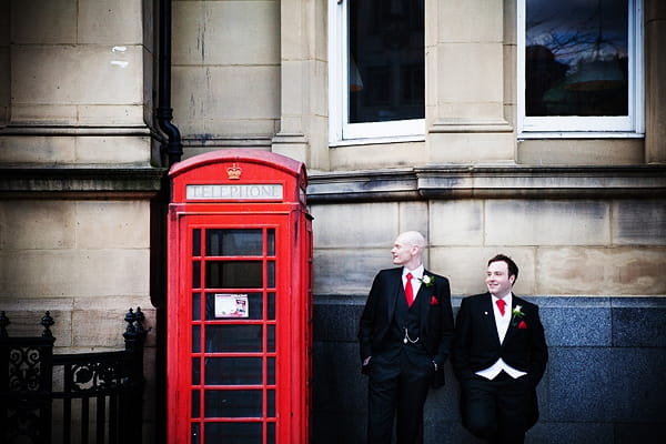 Civil partners standing by red telephone box - An Art Deco Themed Civil Partnership