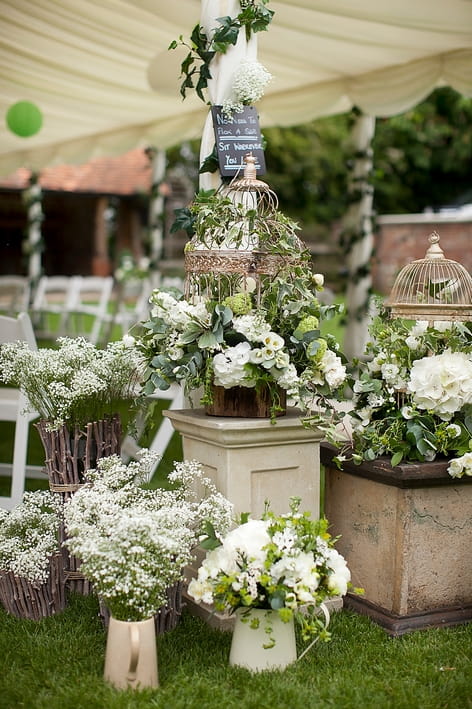 Wedding flowers in pots and jugs - A Beautiful Garden Party Wedding at Lains Barn