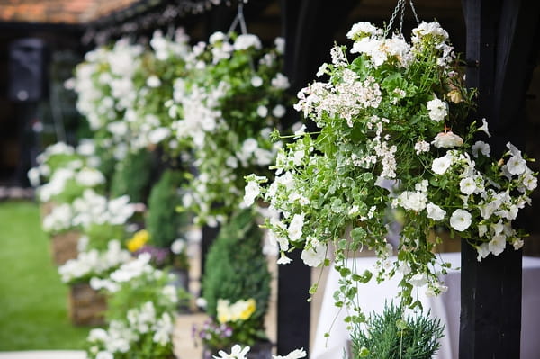 Hanging flowers - A Beautiful Garden Party Wedding at Lains Barn