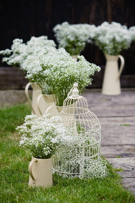 Jugs of lily of the valley - A Beautiful Garden Party Wedding at Lains Barn