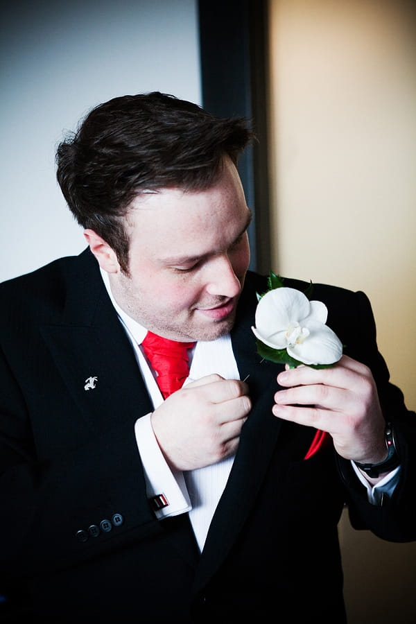 Groom putting on buttonhole - An Art Deco Themed Civil Partnership