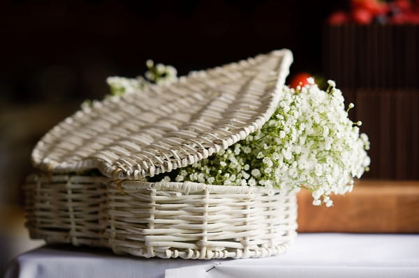 Basket full of lily of the valley - A Beautiful Garden Party Wedding at Lains Barn