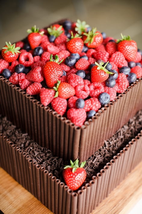 Chocolate and strawberry wedding cake - A Beautiful Garden Party Wedding at Lains Barn