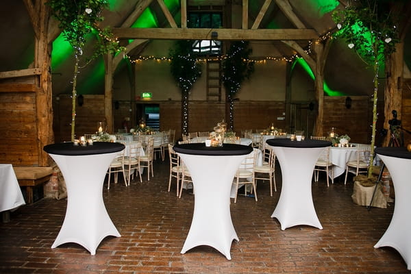 White and black tables in barn - A Beautiful Garden Party Wedding at Lains Barn