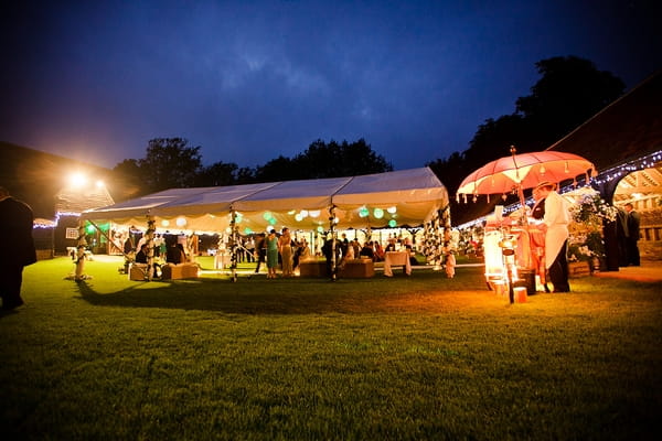 Marquee at night at Lains Barn - A Beautiful Garden Party Wedding at Lains Barn