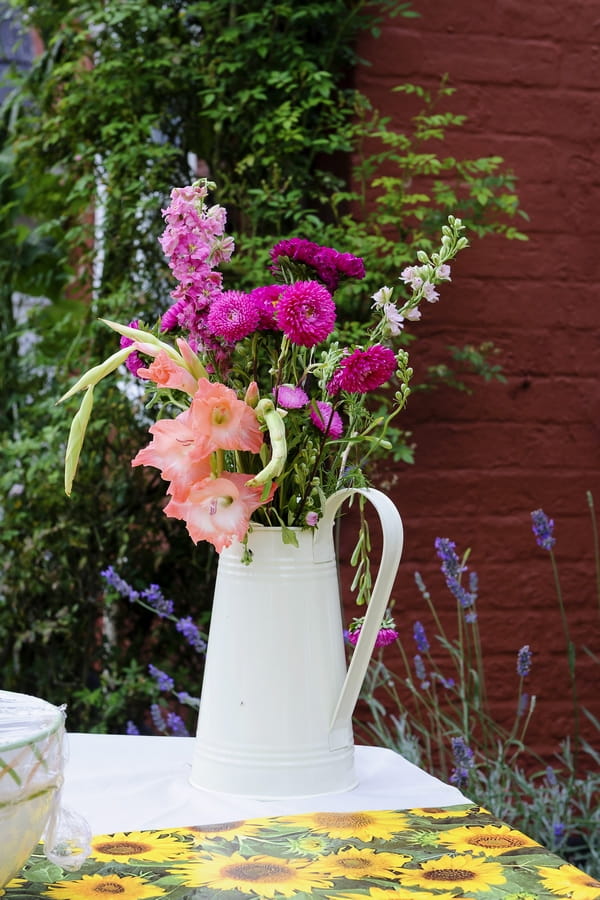 Rustic jug of wedding flowers