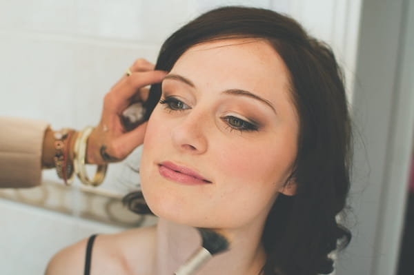 Bride having her make-up done - A Farm Wedding with a British Summer Theme