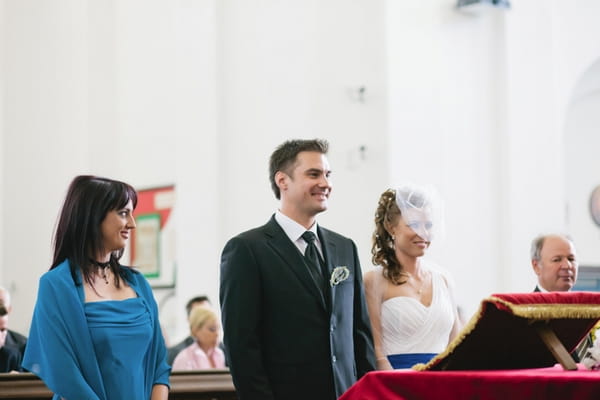 Bride and groom at altar - A Spring Themed Wedding in Hungary