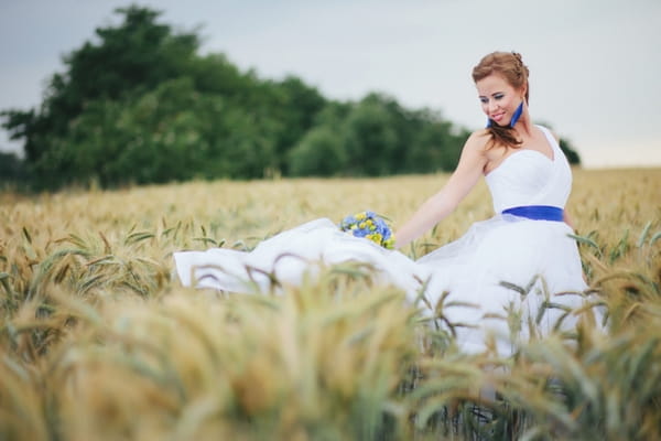 Bride in corn field - A Spring Themed Wedding in Hungary