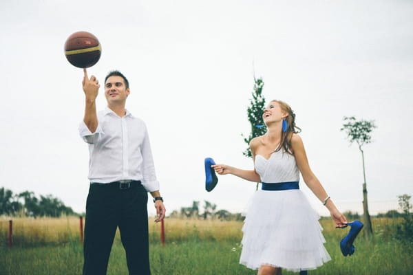 Groom spinning basketball on finger - A Spring Themed Wedding in Hungary