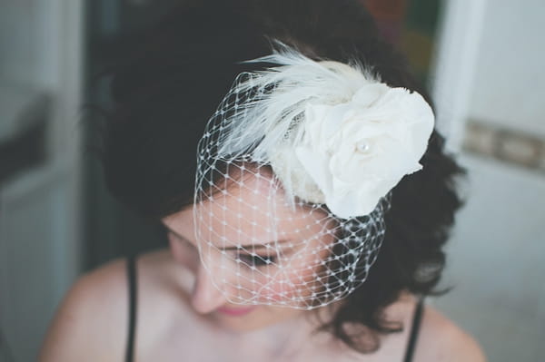 Bride wearing headpiece with birdcage veil - A Farm Wedding with a British Summer Theme