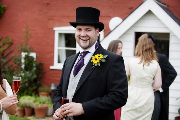 Groom smoking cigar