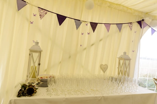 Purple bunting in wedding marquee