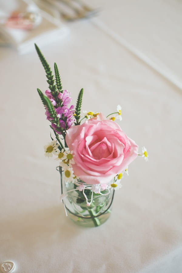 Pink rose on wedding table - A Farm Wedding with a British Summer Theme