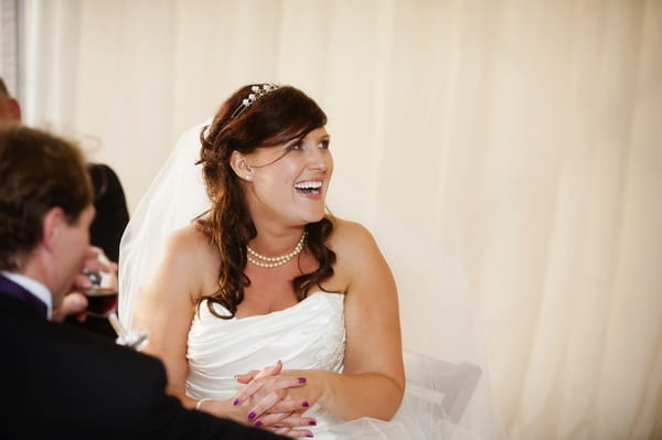 Bride watching wedding speech