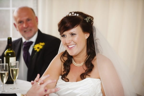 Bride holding groom's hand