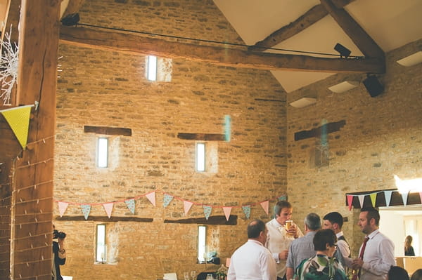 Wedding reception in barn at Winkworth Farm - A Farm Wedding with a British Summer Theme