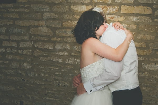 Bride and groom hugging - A Farm Wedding with a British Summer Theme