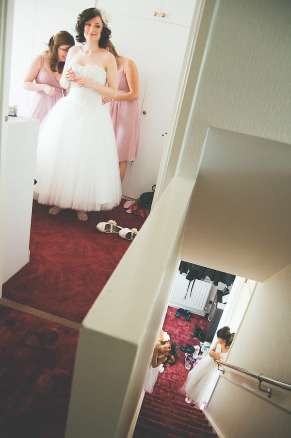 Bride at top of stairs - A Farm Wedding with a British Summer Theme