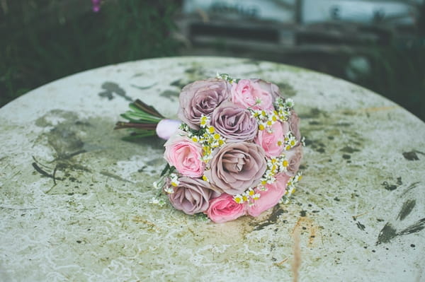 Rose bridal bouquet on table - A Farm Wedding with a British Summer Theme