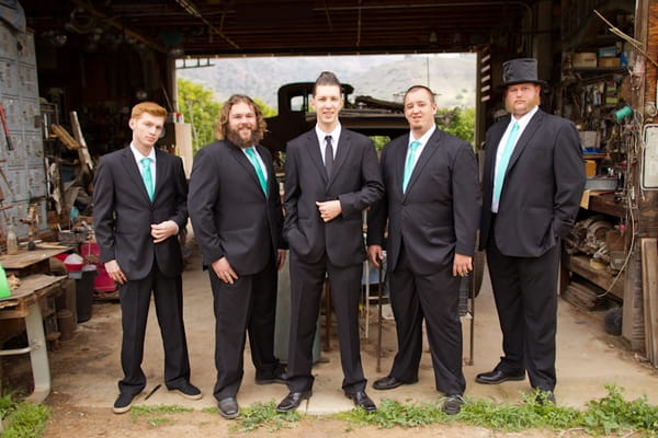 Groom standing with groomsmen