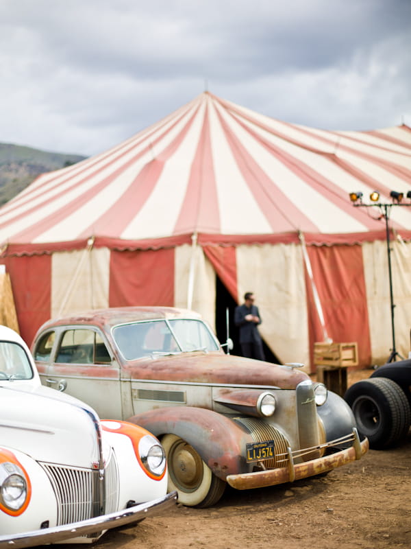 Old cars outside circus tent