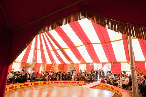 Wedding guests in circus tent for wedding ceremony